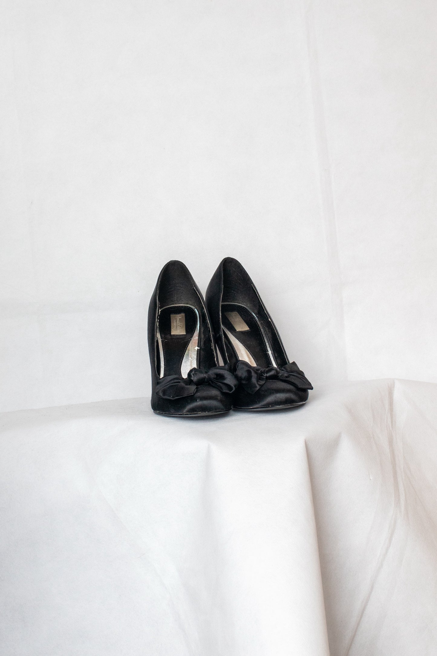 Black bow heels