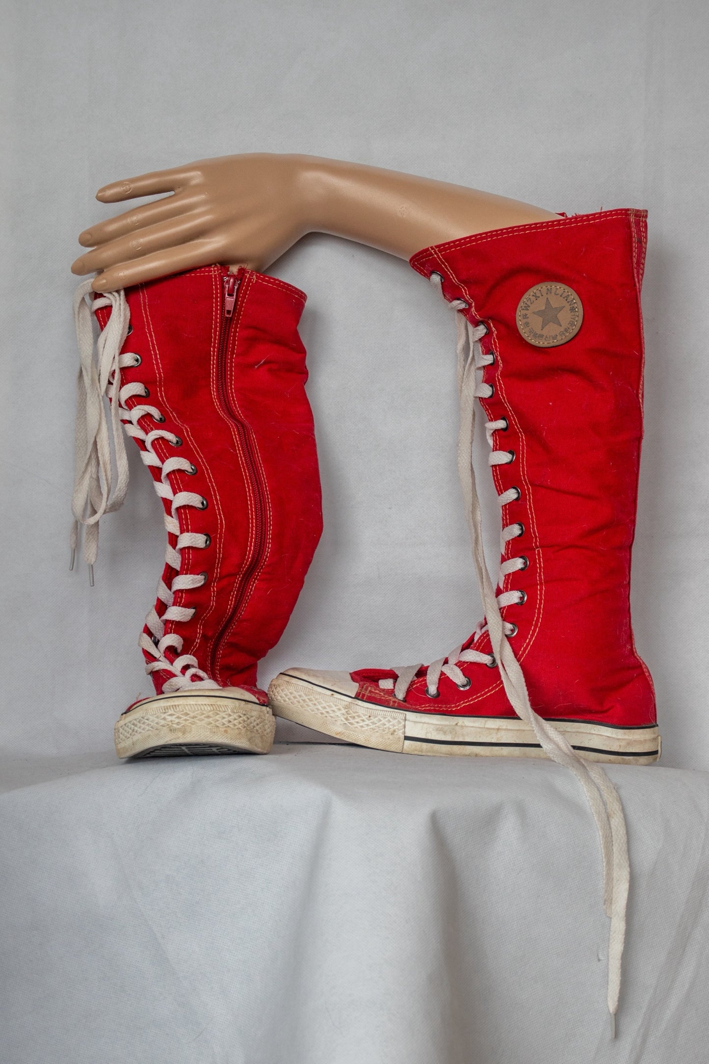 Red converse style knee height boots