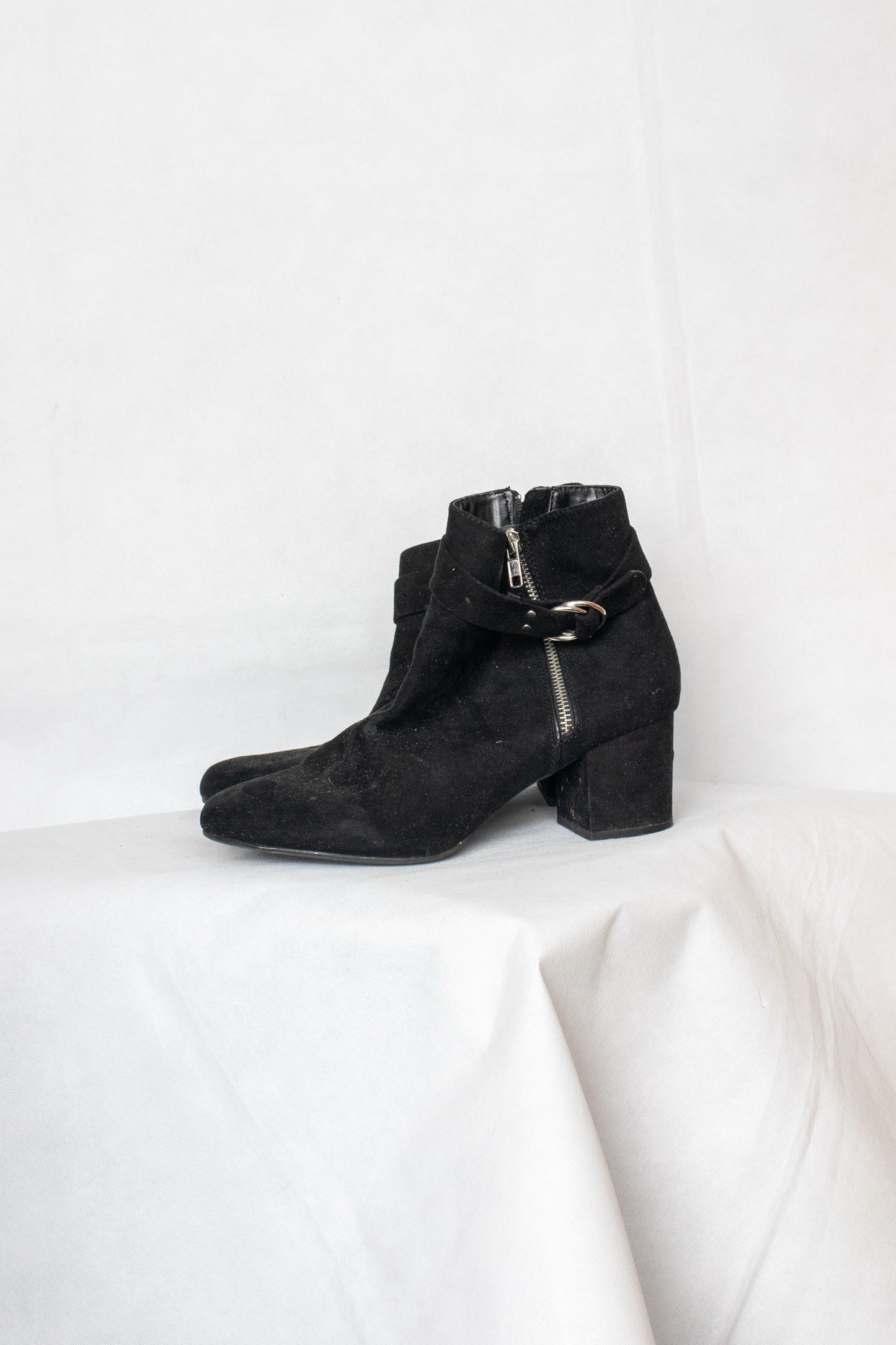 Black buckled boots