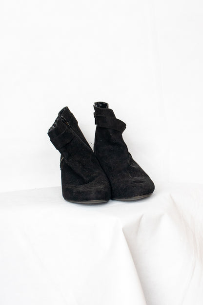 Black buckled boots