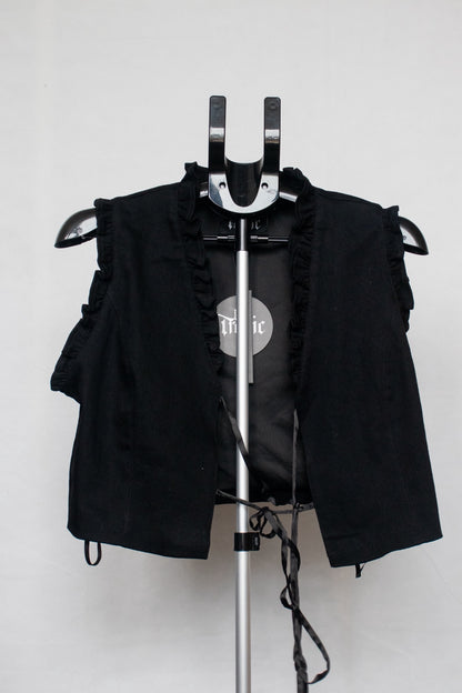Black lace up vest with embroidered heart on back