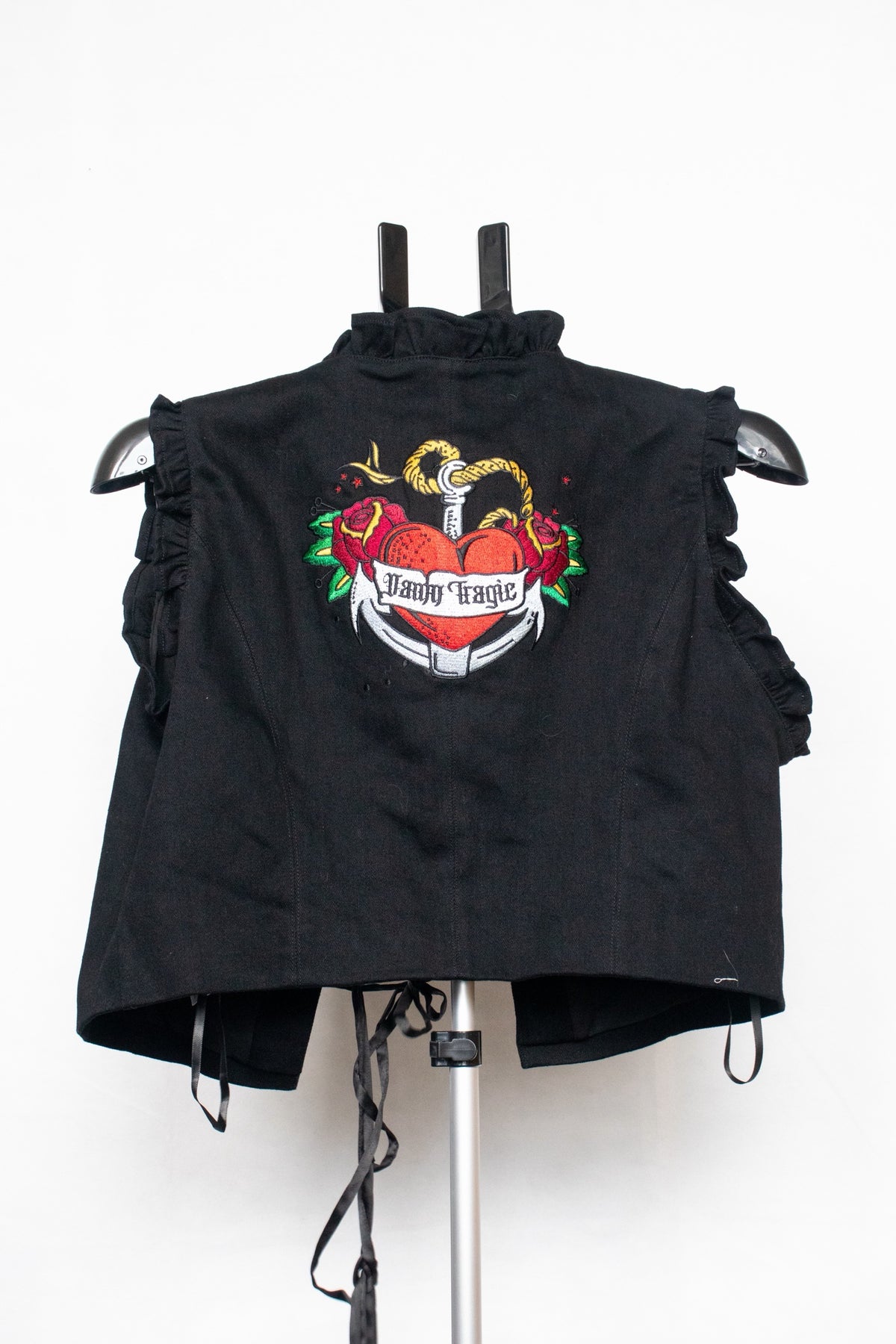 Black lace up vest with embroidered heart on back
