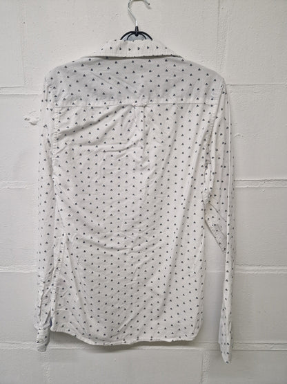 White shirt with black triangular pattern