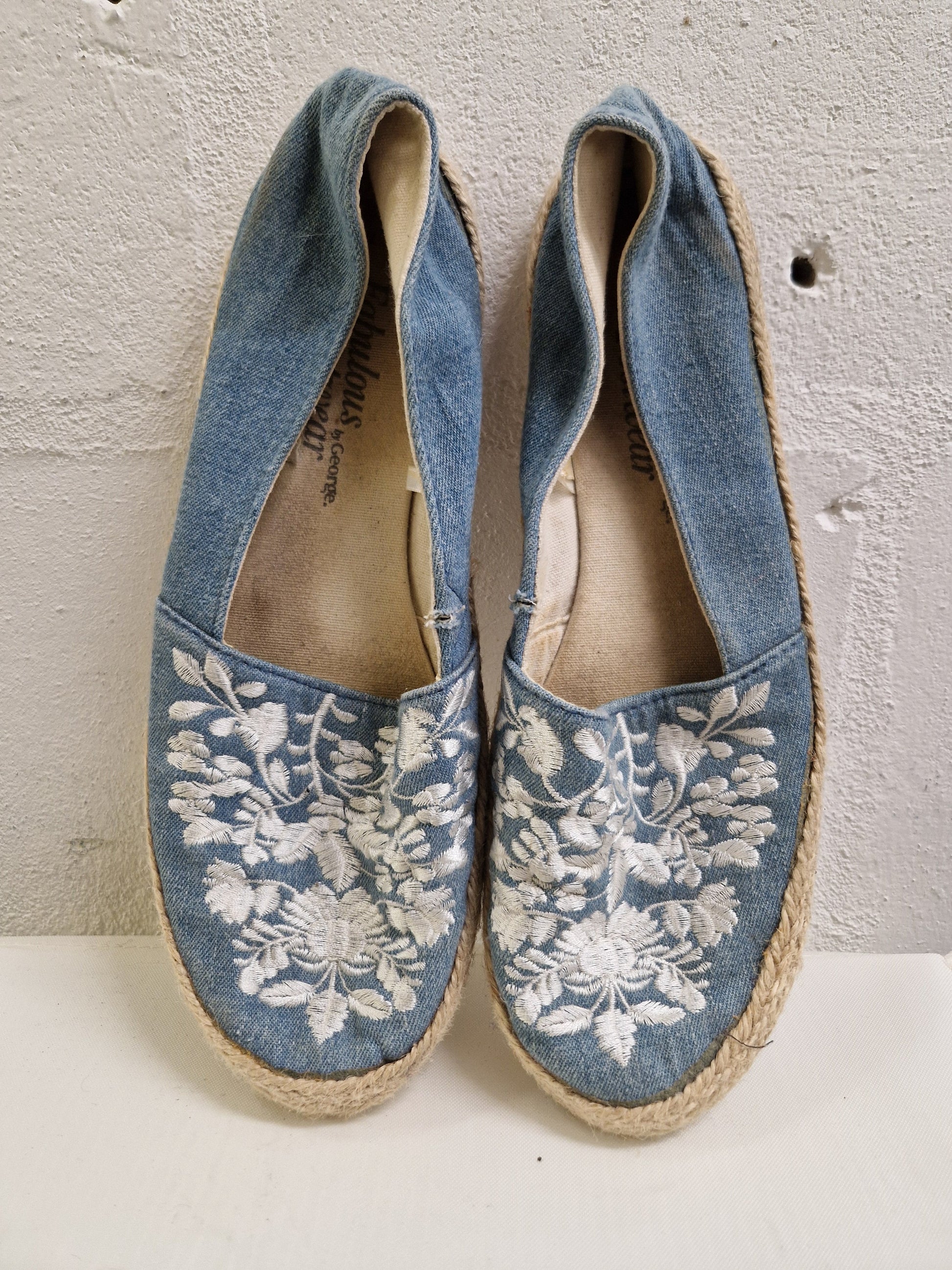 blue denim espadrilles with white flower embroidery. George