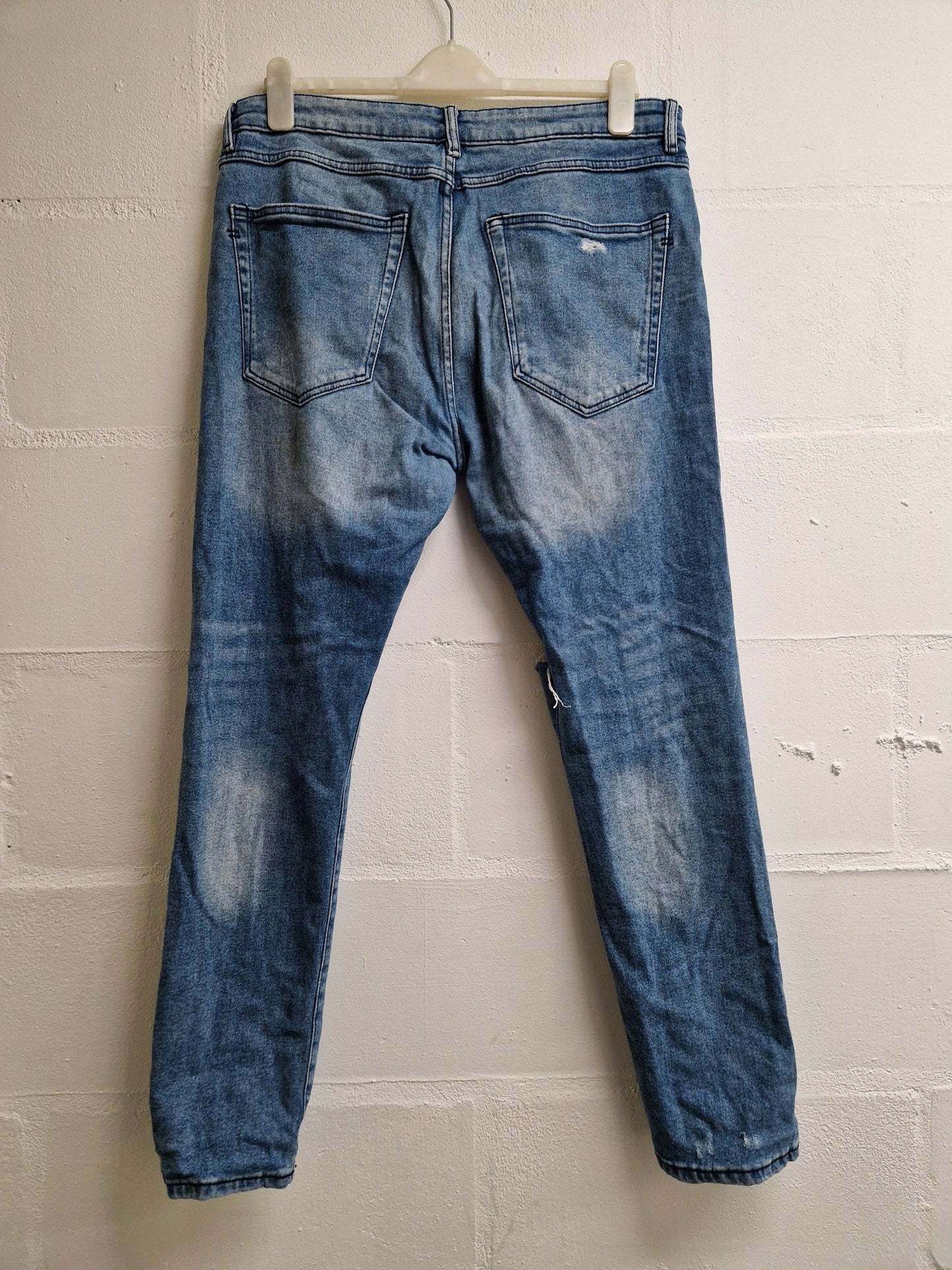 light blue distressed jeans