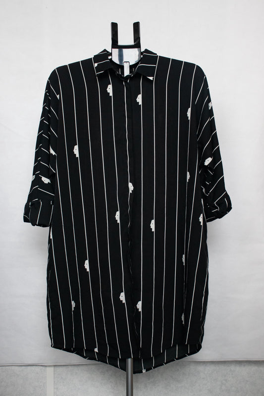 Black shirt with white stripes and faces