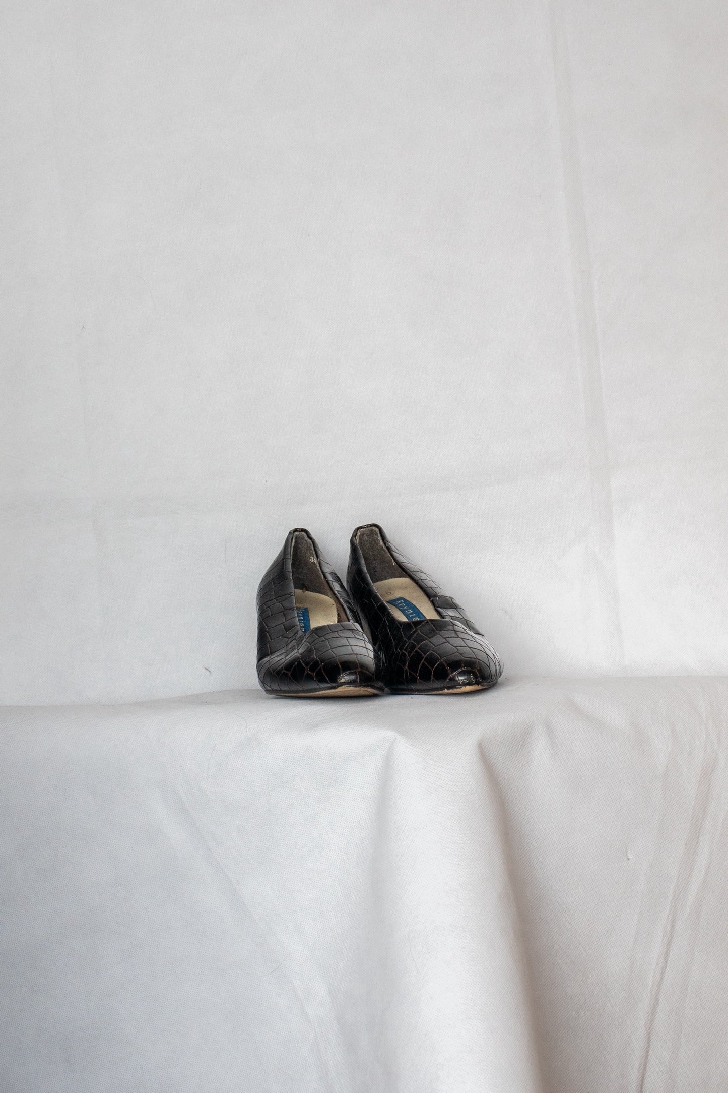 Black alligator skin kitten heels