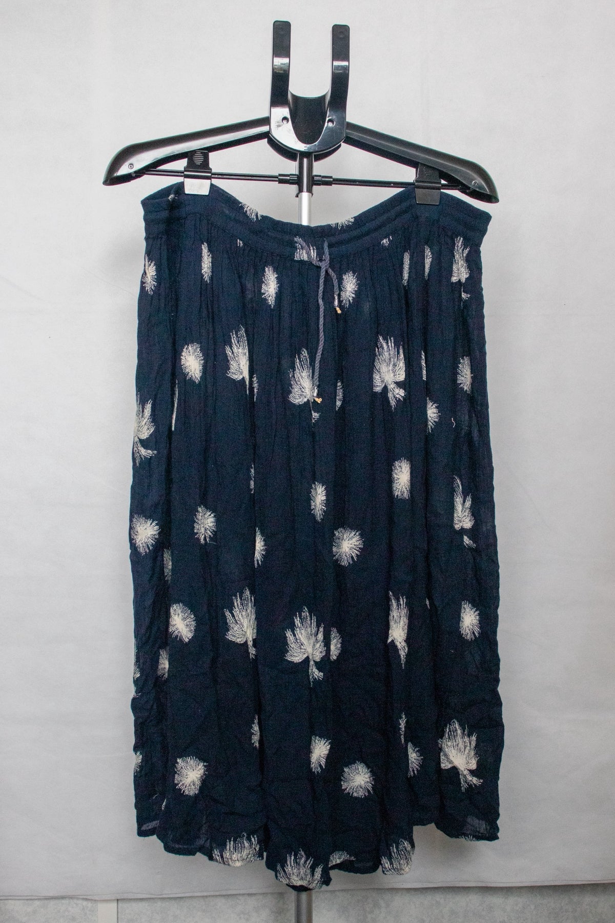 Blue skirt with dandelion/seed design
